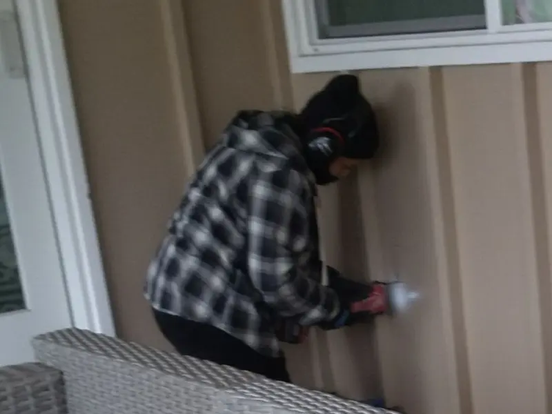 Professional electrician installing an exterior outlet in Salem